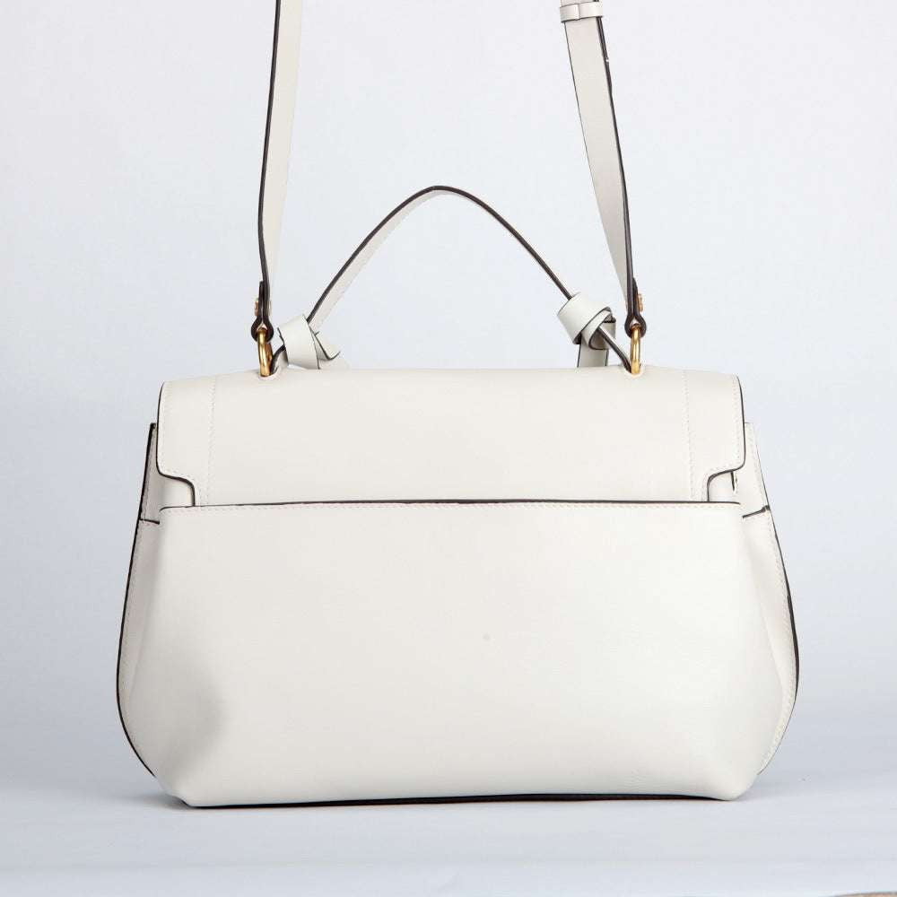 chic white handbags, leather clamshell handbags, summer handbag trends - available at Sparq Mart